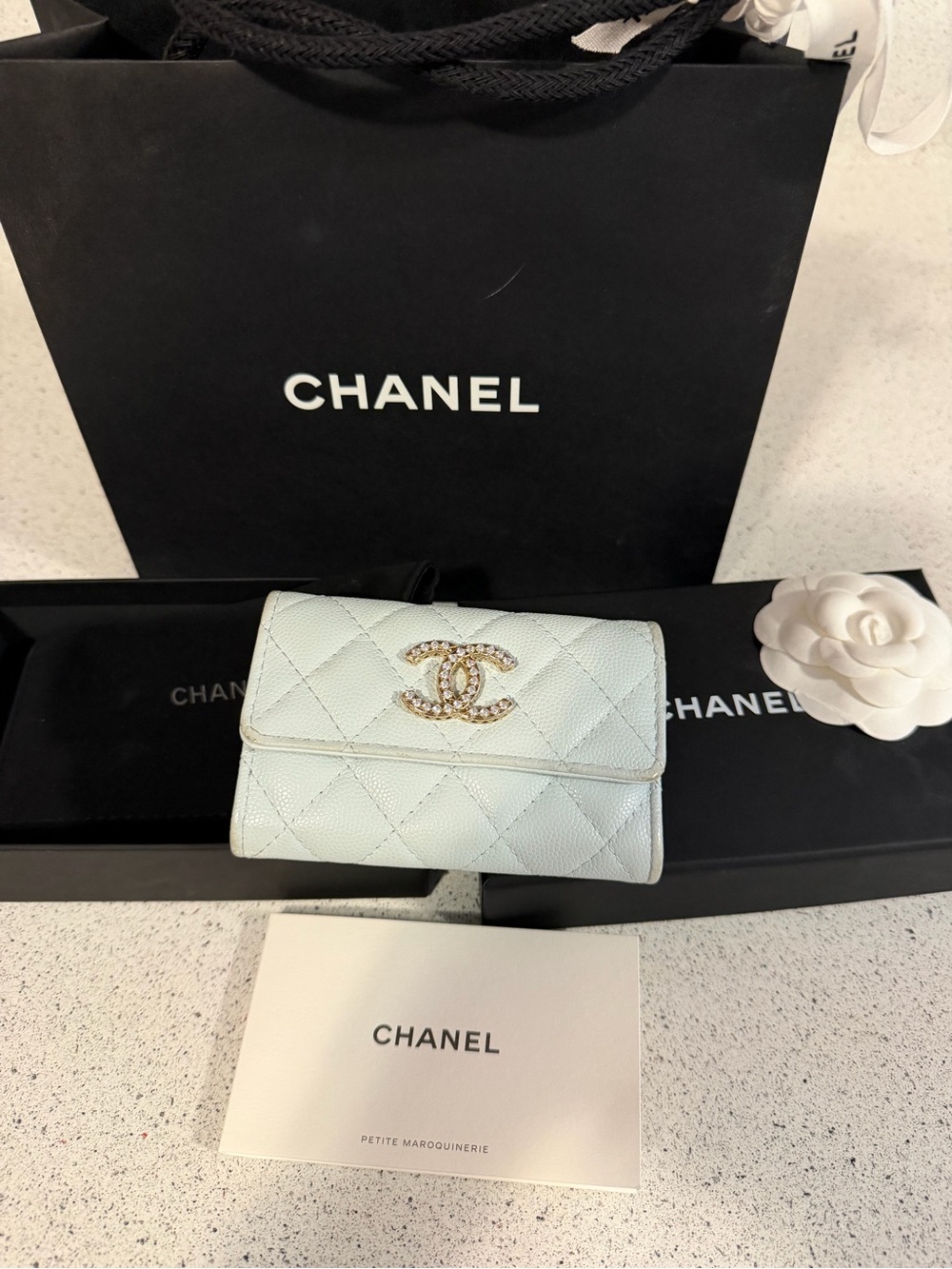 Chanel shiny caviar quilted crystal CC flap card holder light blue
